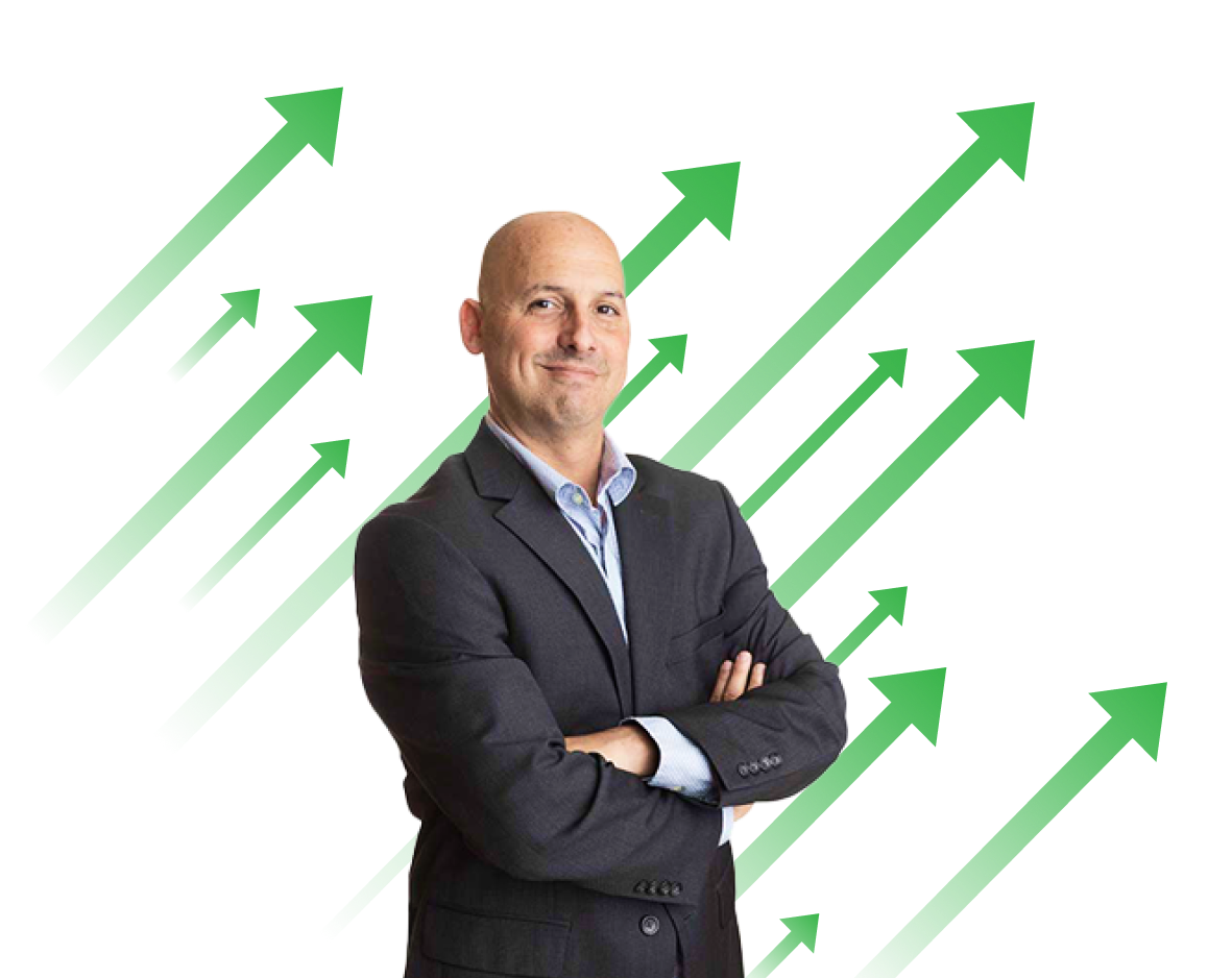 Analyst Kenny Glick stands arms crossed in front of green arrows pointing to upper right